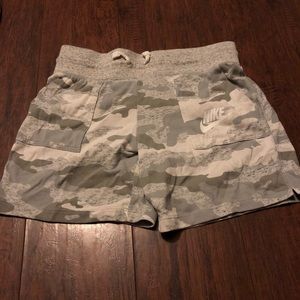 White and grey camp NIKE sweat shorts.